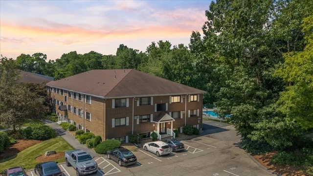 a aerial view of a house with swimming pool and furniture