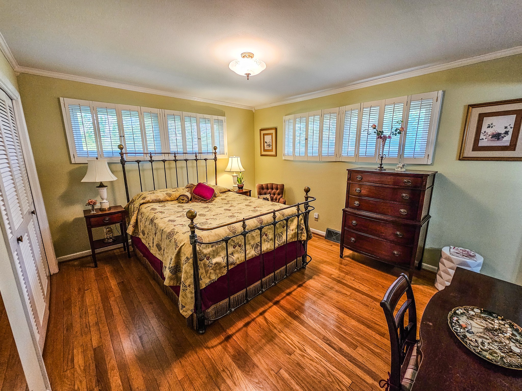 401 South Valley Road Shelbyville, TN 37160 - Photo 23 of 41 This is the Master Bedroom with wooden shutters on the windows, beautiful hardwood floors in great condition. It is now vacant.