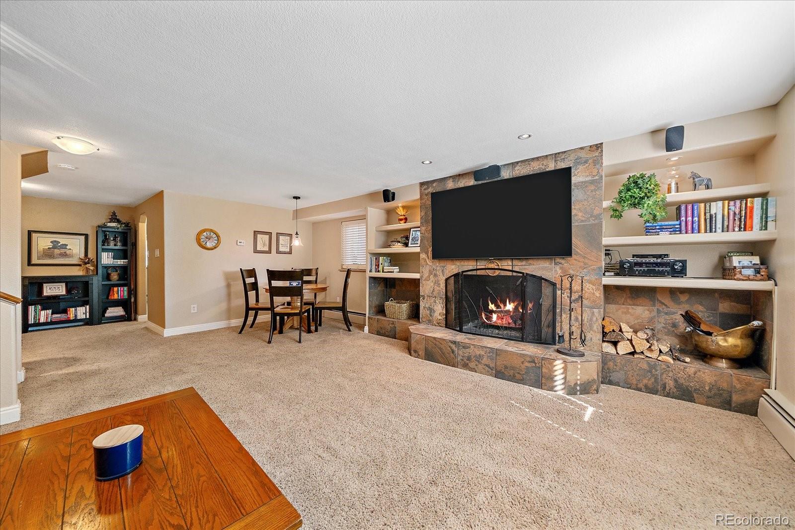 930 Reed Court Lakewood, CO 80214 - Photo 20 of 41 a living room with furniture and a fireplace