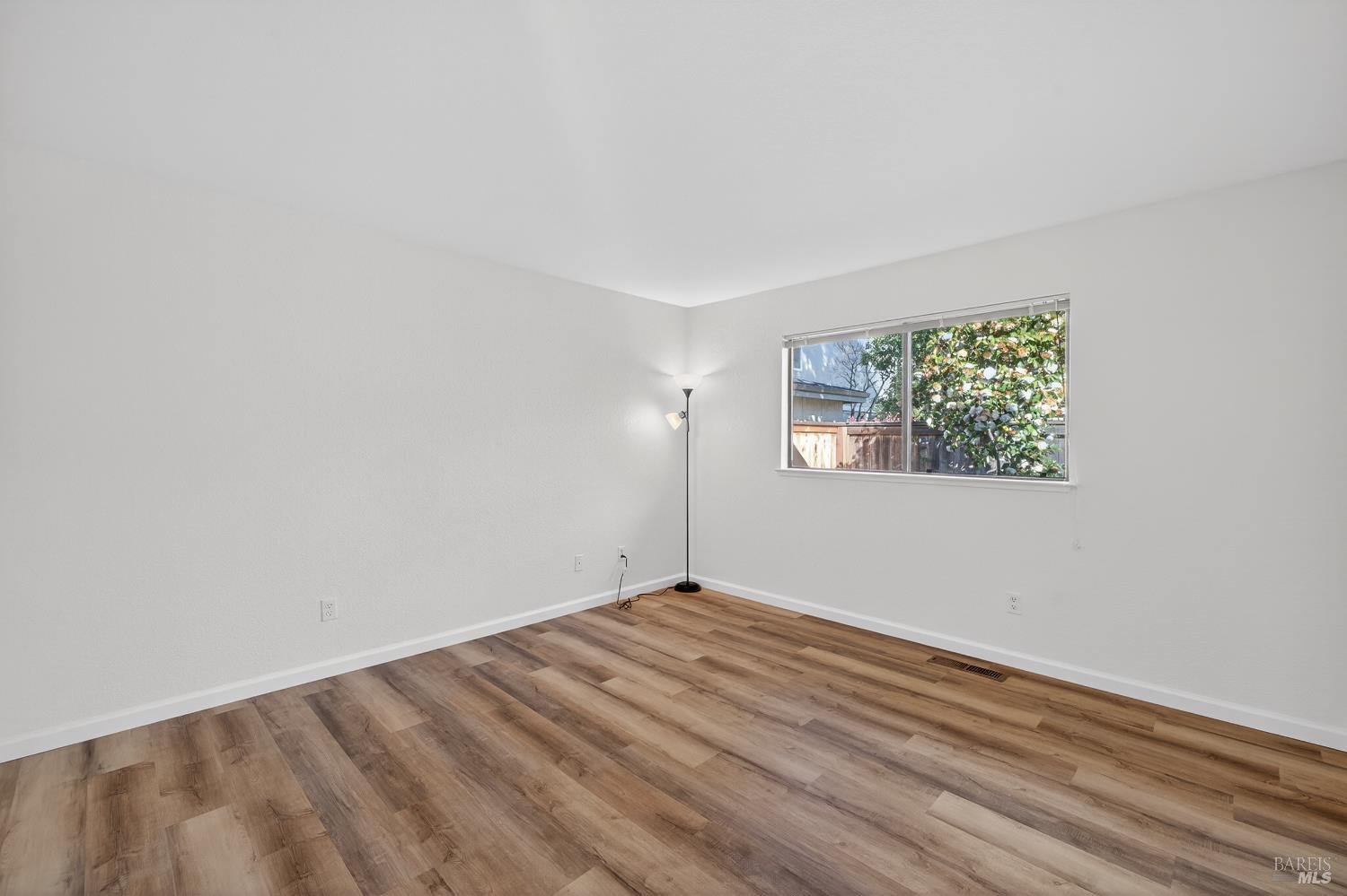 663 Spring Lane Sonoma, CA 95476 - Photo 9 of 24 a view of empty room with wooden floor