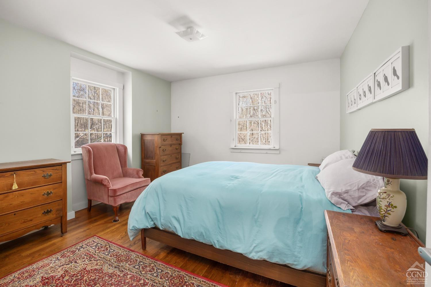 1235 Ira Vail Road Leeds, NY 12451 - Photo 18 of 35 a bedroom with a bed and chair