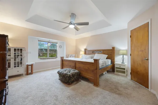 a bed room with a bed and a chair