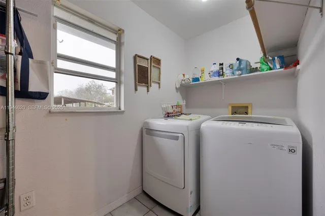 a utility room with dryer and washer
