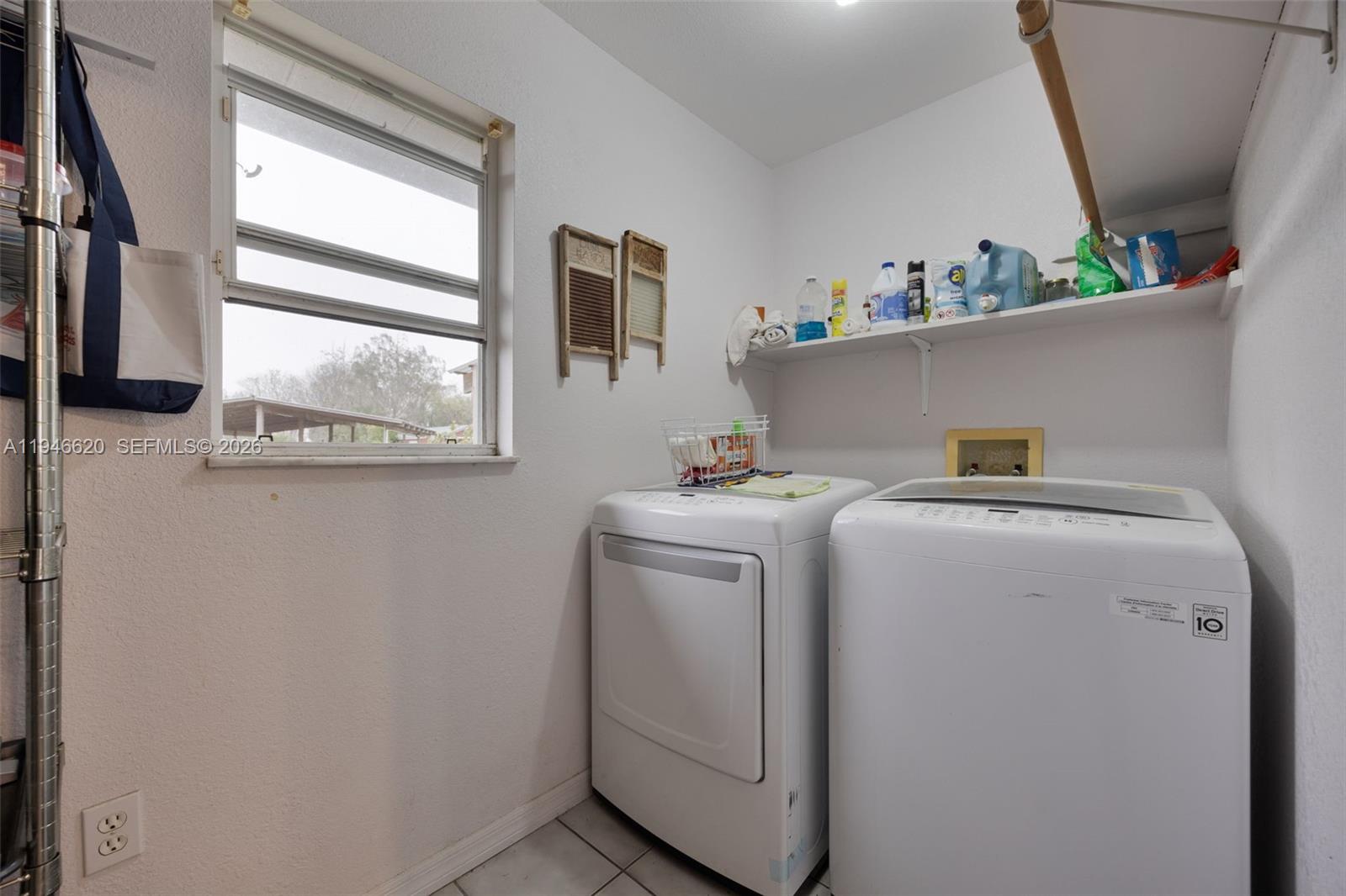 2915 Ortona Locks Road Moore Haven, FL 33471 - Photo 16 of 20 a utility room with dryer and washer