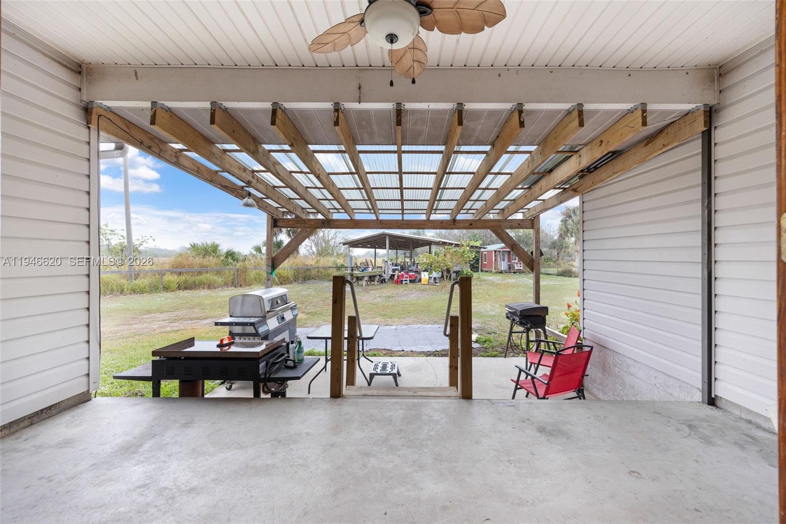 2915 Ortona Locks Road Moore Haven, FL 33471 - Photo 17 of 20 a view of a room with wooden ceiling