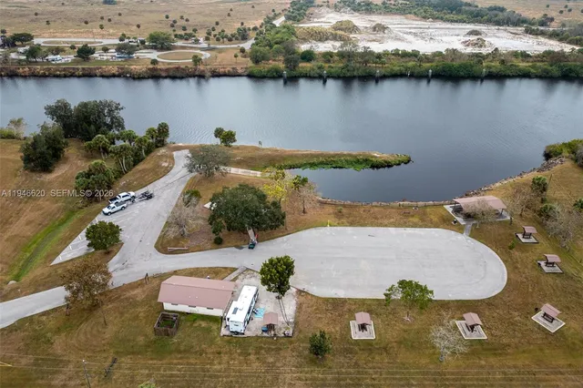 an aerial view of a house with a lake view