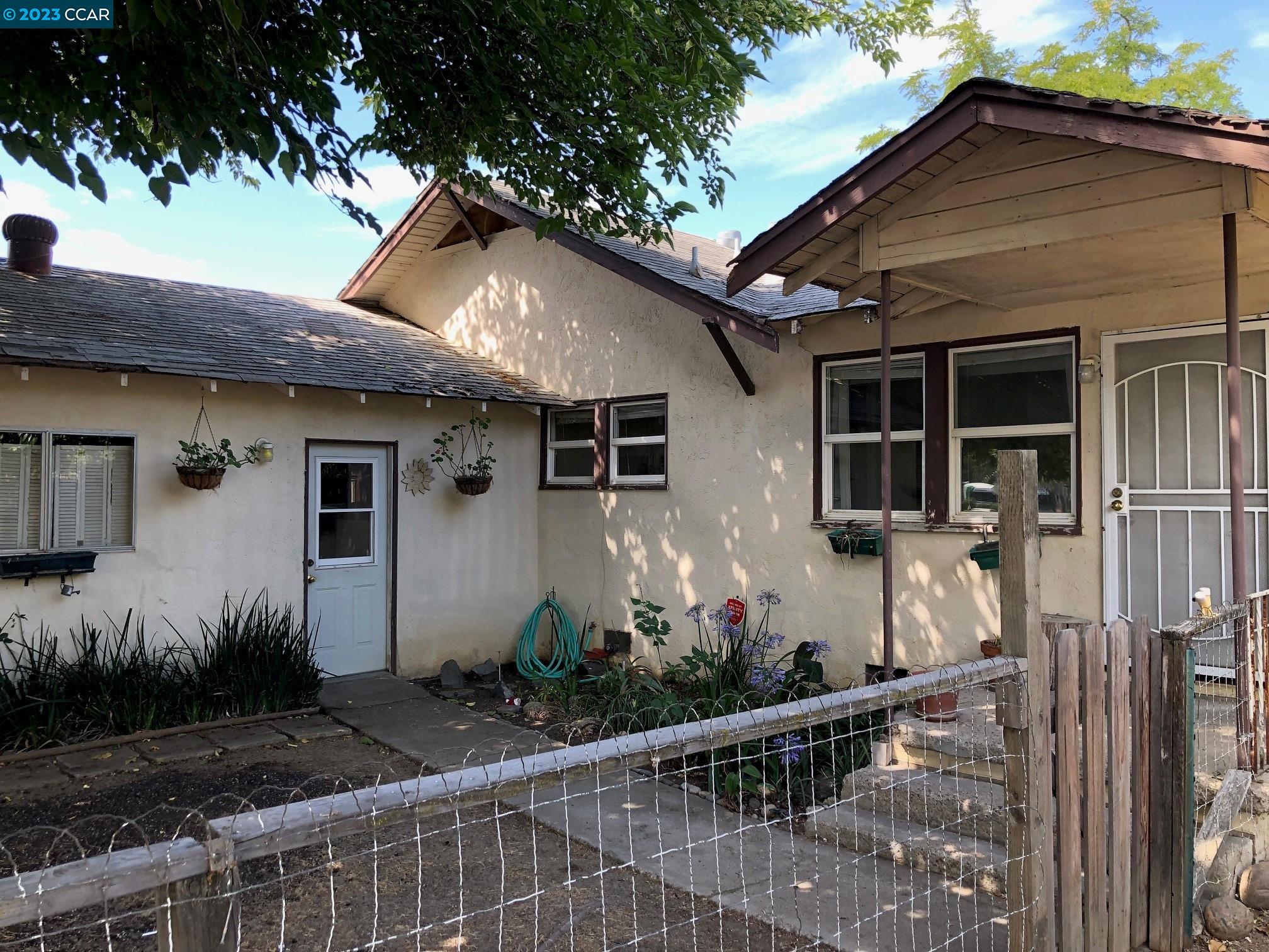 a front view of house with yard
