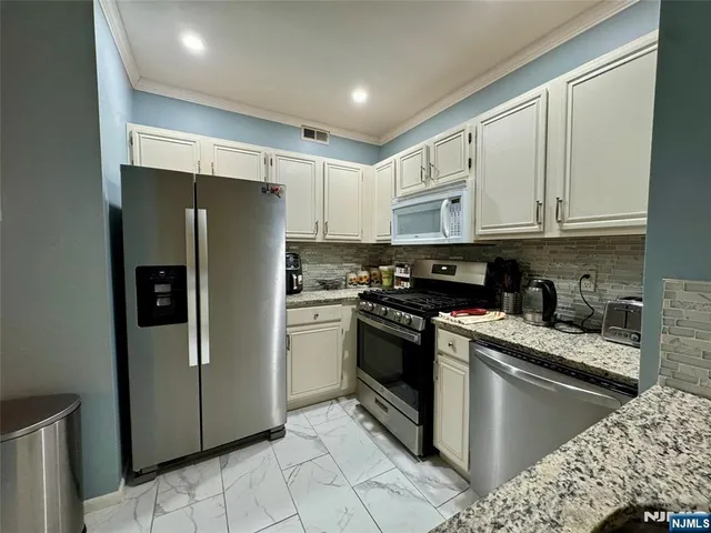 a bedroom with a bed and dresser