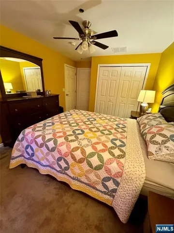 a bathroom with a toilet and a shower curtain