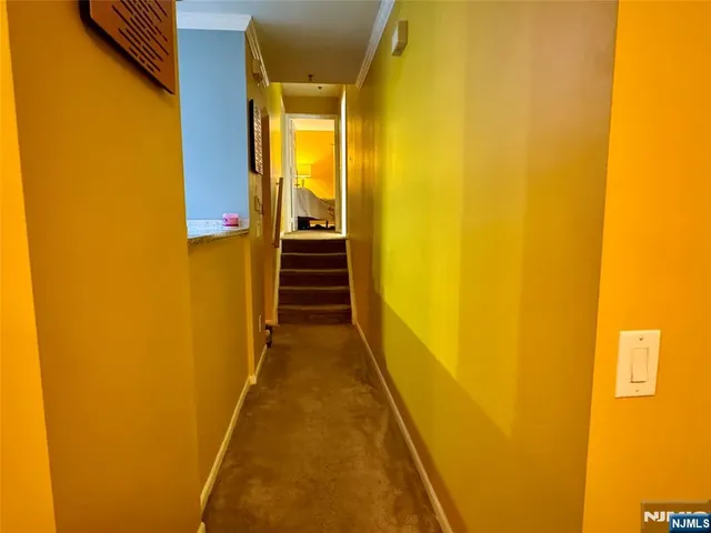 a bathroom with a sink mirror vanity and toilet