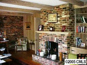 2901 Ferncliff Road Charlotte, NC 28211 - Photo 3 of 8 a living room with a wooden floor and a fireplace