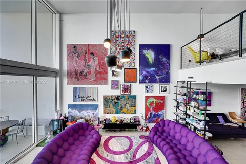 a bedroom with furniture and a chair