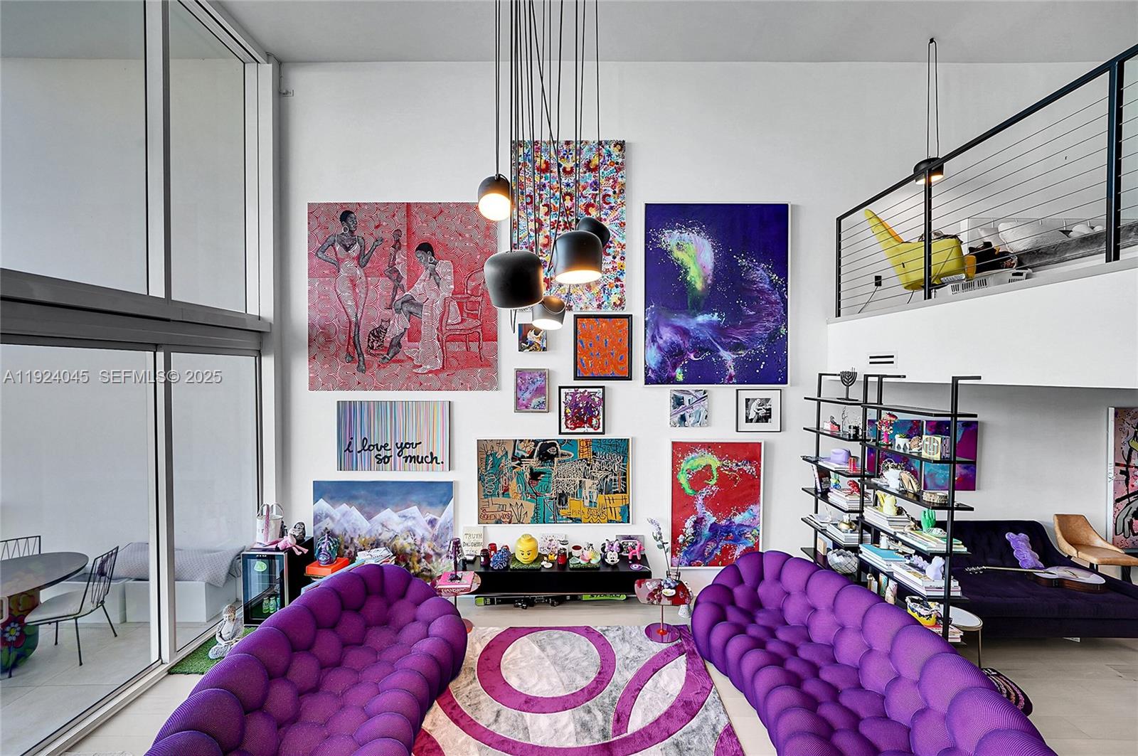 1040 Biscayne Boulevard, Unit 2603 Miami, FL 33132 - Photo 12 of 40 a bedroom with furniture and a chair