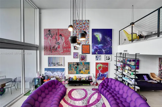 a bedroom with furniture and a chair