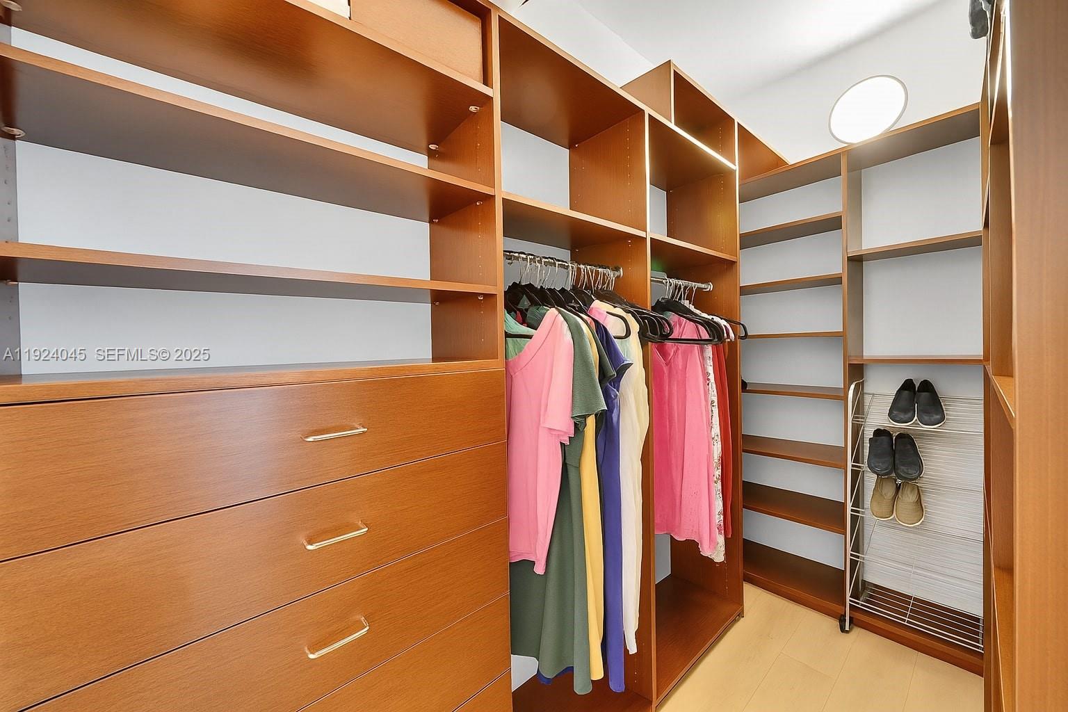 1040 Biscayne Boulevard, Unit 2603 Miami, FL 33132 - Photo 19 of 40 a view of walk in closet with empty racks