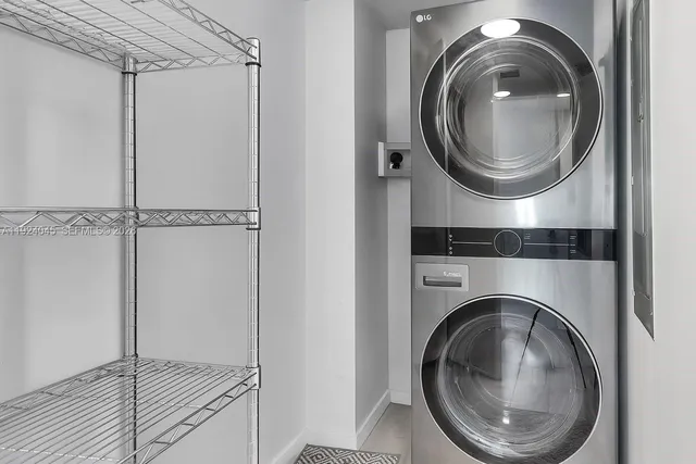 a close view of a in a utility room with dryer and washer