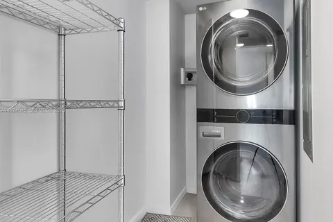 a close view of a in a utility room with dryer and washer