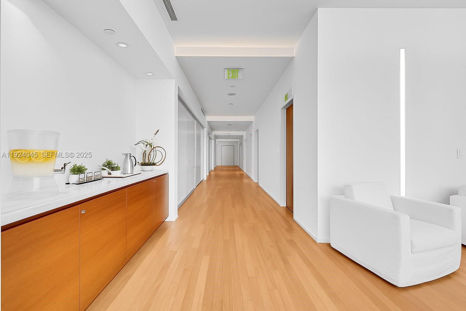 1040 Biscayne Boulevard, Unit 2603 Miami, FL 33132 - Photo 26 of 40 a view of a living room hardwood and kitchen