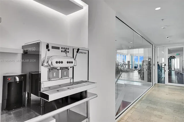 a view of a hallway with seating area