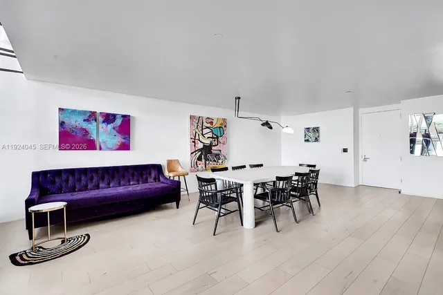 a view of a livingroom with furniture and wooden floor