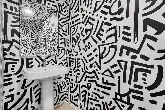 a view of a door and chair in the kitchen