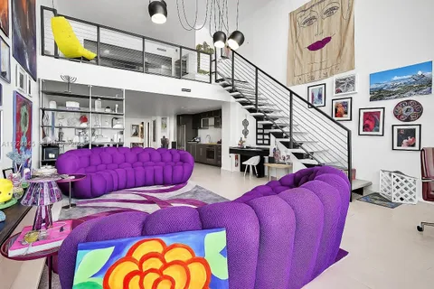 a view of walk in closet with clothes