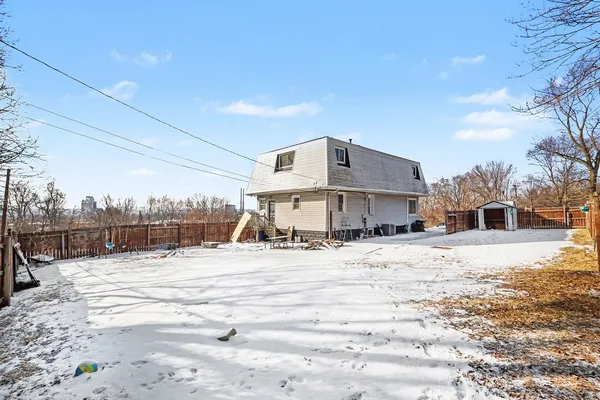a view of a house with a snow on the road