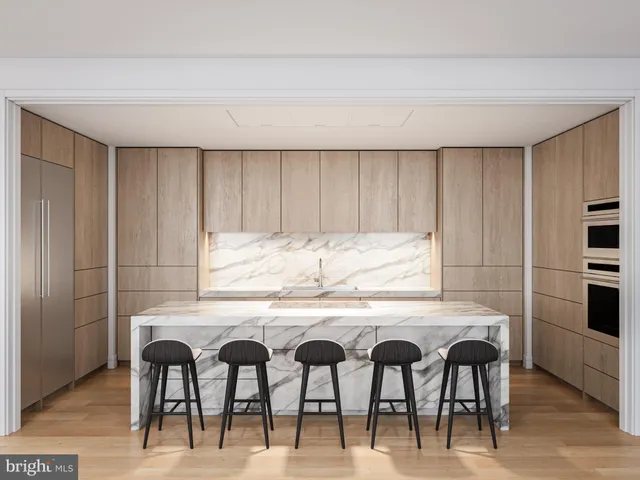 a kitchen with a table and chairs