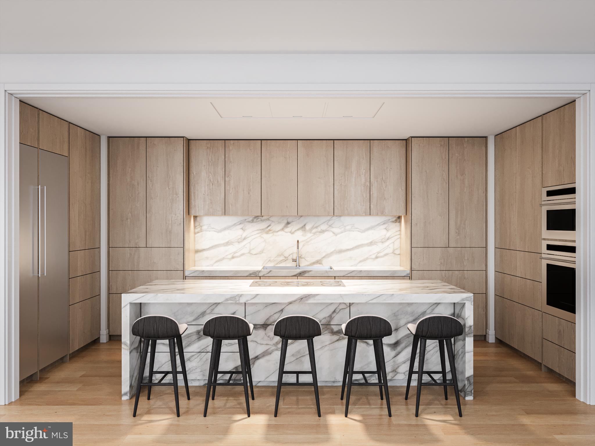 1414 South Penn Square, Unit PH1C Philadelphia, PA 19102 - Photo 3 of 19 a kitchen with a table and chairs