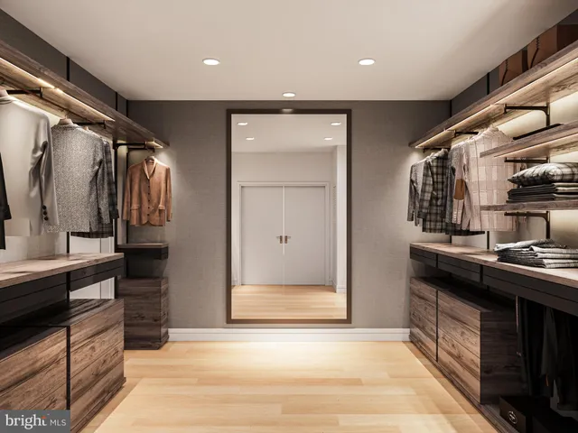 a kitchen with stainless steel appliances granite countertop a refrigerator and a stove