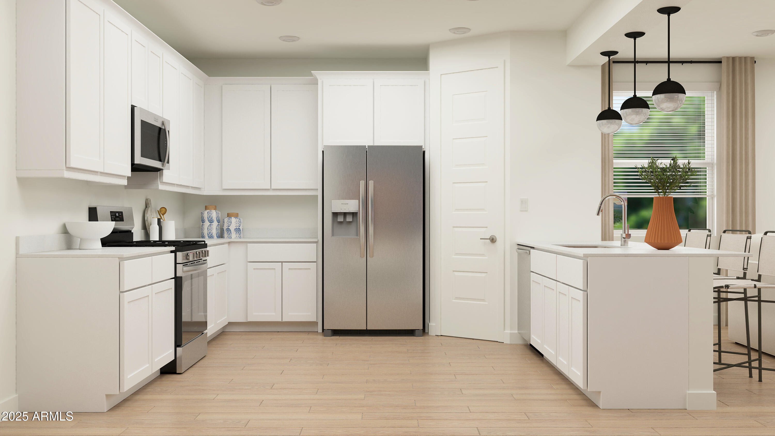 23336 West Chipman Road Buckeye, AZ 85326 - Photo 3 of 17 a kitchen with cabinets and stainless steel appliances