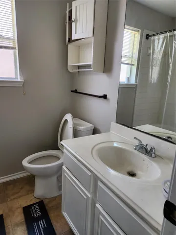 a bathroom with a sink and a toilet