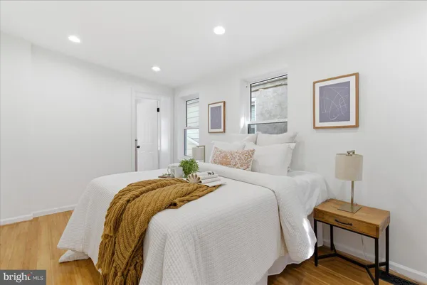 a bed room with a bed and a chair