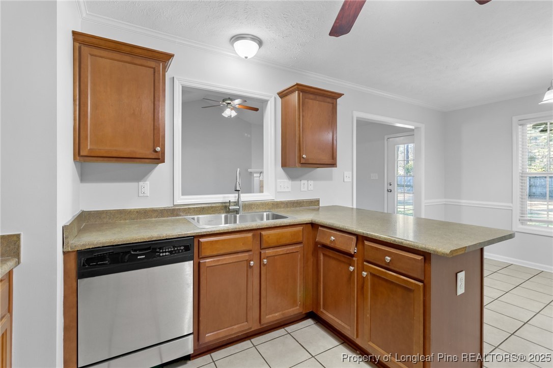 812 Raspberry Road Stedman, NC 28391 - Photo 12 of 34 a kitchen with a sink stove and cabinets