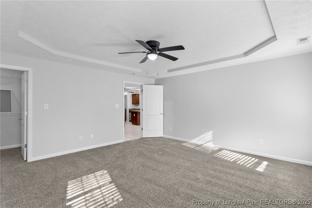812 Raspberry Road Stedman, NC 28391 - Photo 16 of 34 a view of a livingroom with a chandelier fan