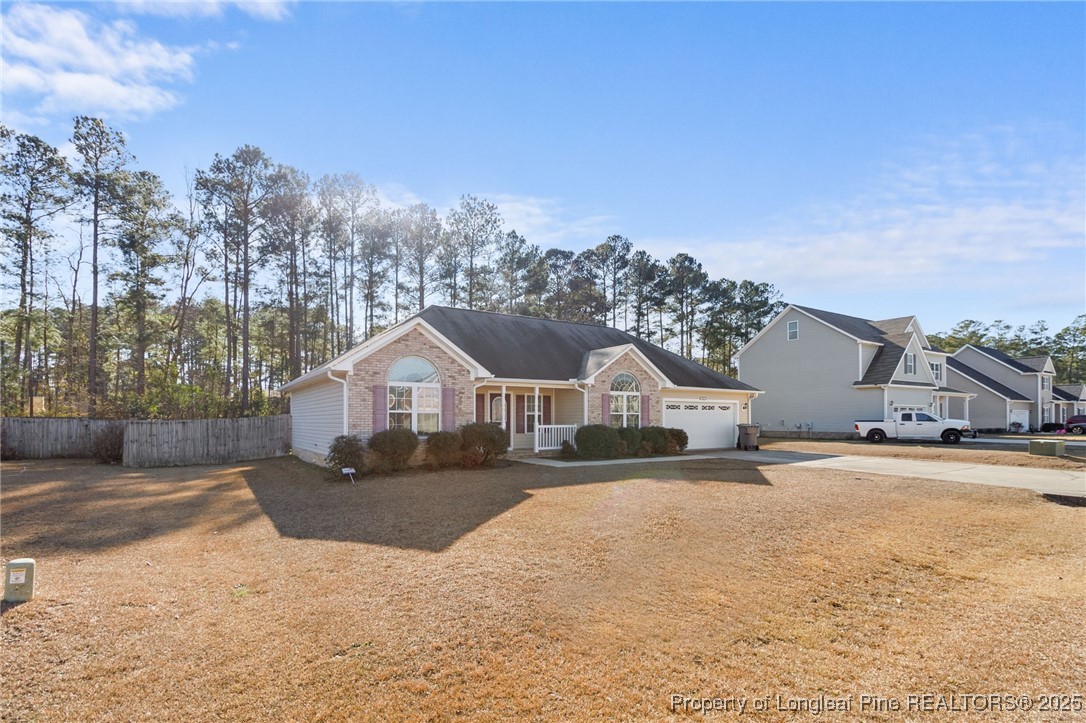 812 Raspberry Road Stedman, NC 28391 - Photo 2 of 34 front view of a house with a yard