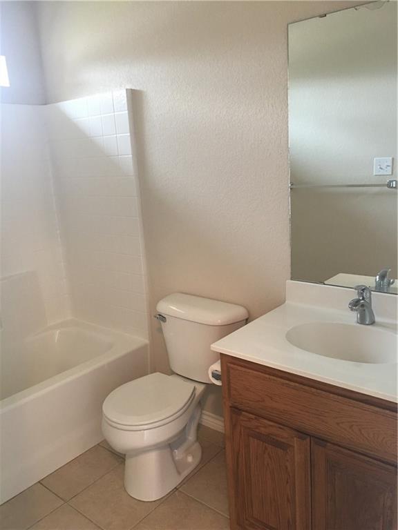 2218 Old Ironsides Road Abilene, TX 79601 - Photo 12 of 26 a bathroom with a sink a toilet and shower
