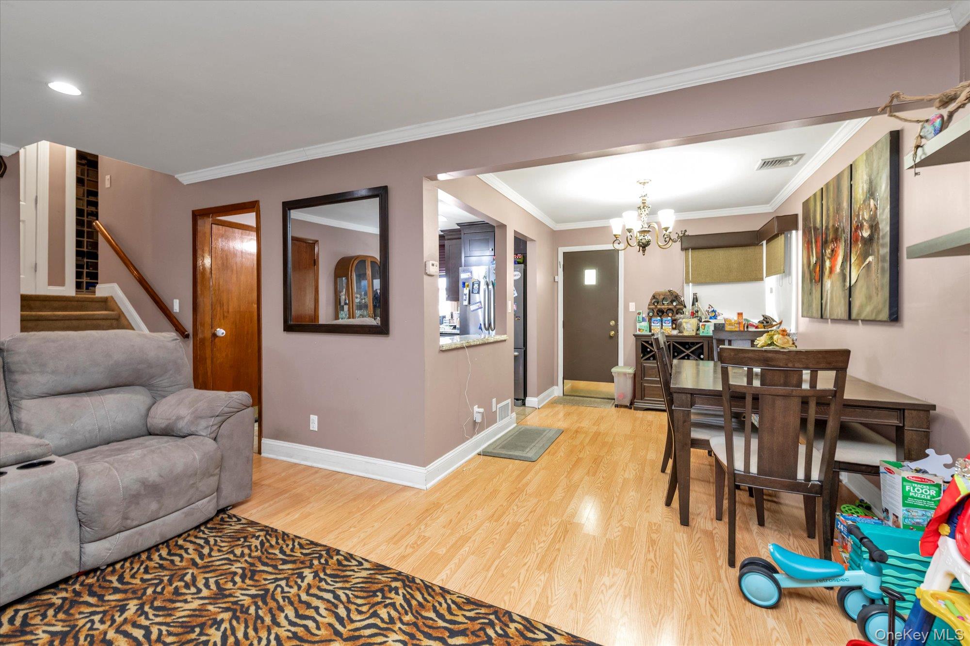 16 Layton Street Freeport, NY 11520 - Photo 3 of 17 a living room with furniture and wooden floor
