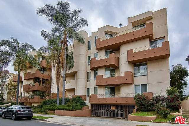 a city street lined with buildings and cars