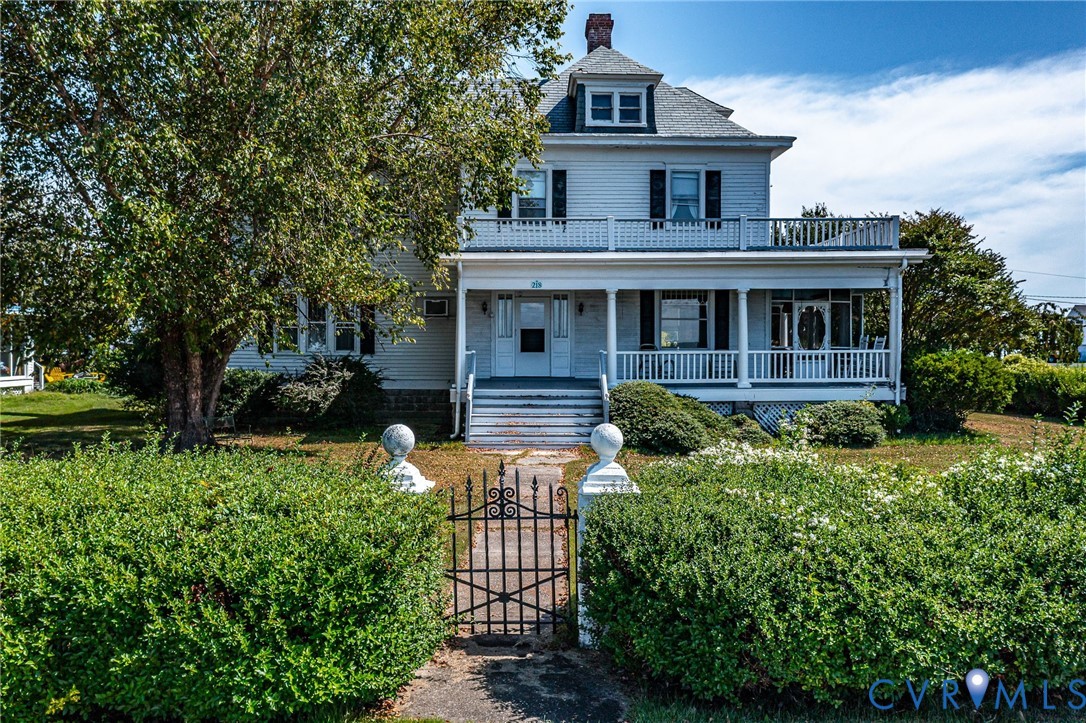 218 Fleeton Point Circle Reedville, VA 22539 - Photo 1 of 43 View of front of home with a chimney, a porch, a g