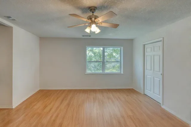 an aerial view of a houses with a lake view