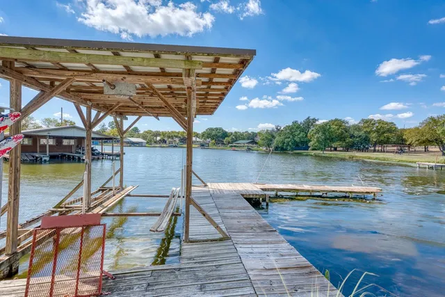 a view of a lake with houses in the back