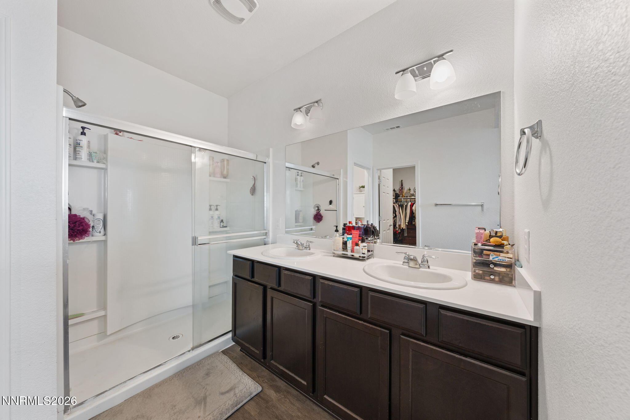 9708 Sea Glass Drive Reno, NV 89506 - Photo 19 of 51 a bathroom with a shower sink vanity and mirror
