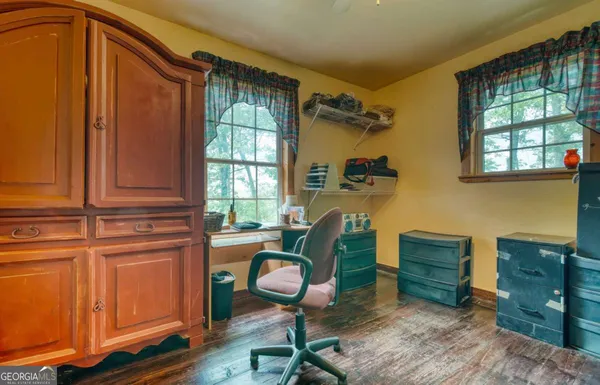 a work room with furniture and windows
