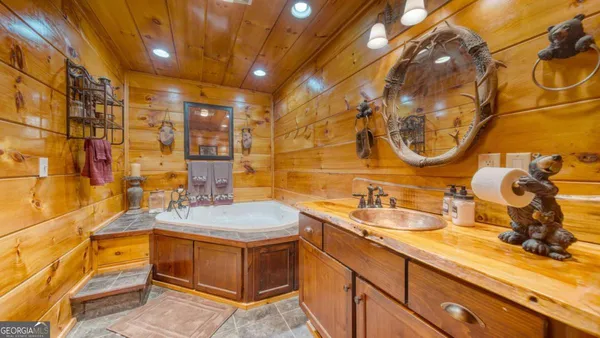 a bathroom with a sink and a mirror