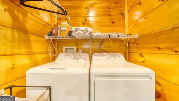 a utility room with a washing machine