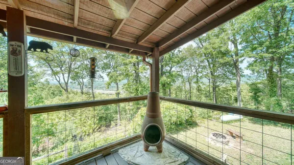 a view of outdoor space with deck and furniture