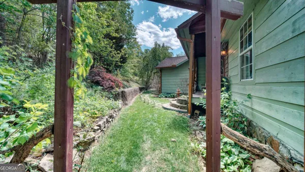 a backyard of a house with lots of green space