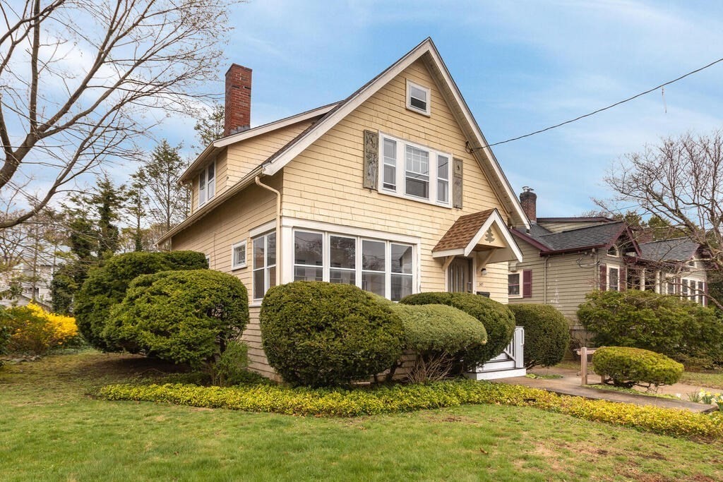 145 Robbins Road Arlington, MA 02476 - Photo 1 of 31 a front view of a house with a yard