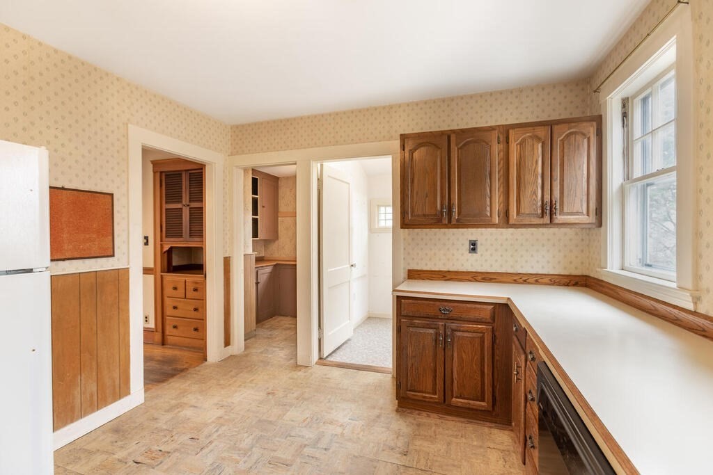 145 Robbins Road Arlington, MA 02476 - Photo 15 of 31 a view of a kitchen with refrigerator and window